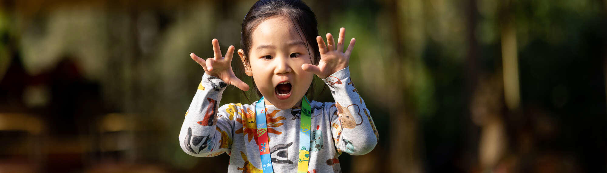 A girl roaring at the camera