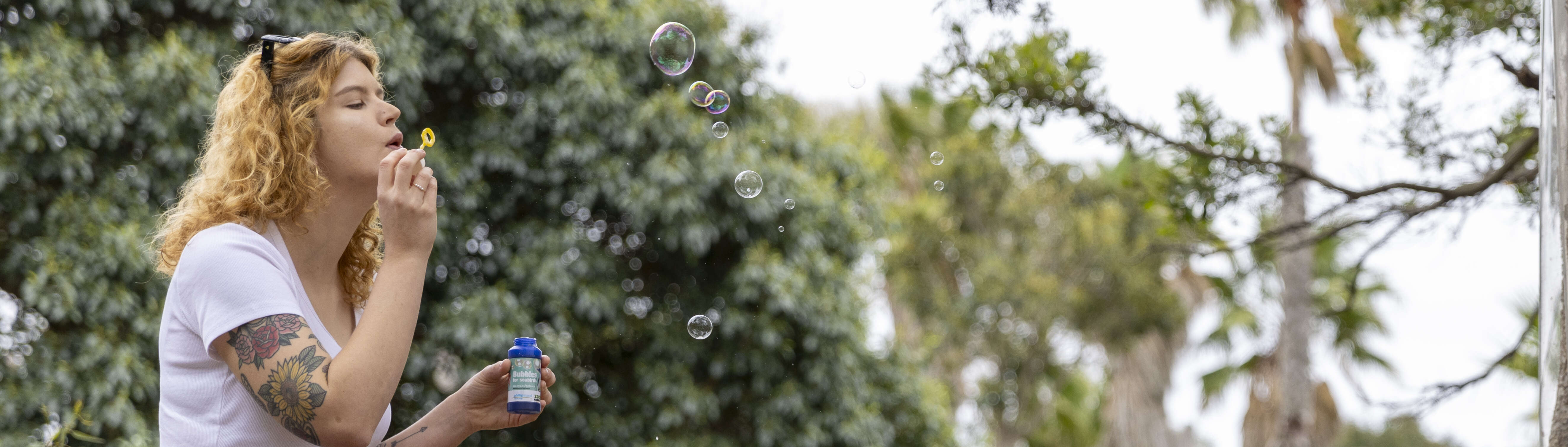 Adult blowing bubbles.